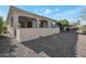 Covered patio with artificial turf and seating area, offering a private outdoor space at 16914 W Merrell St, Goodyear, AZ 85395