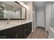 Elegant bathroom with double sinks and a large mirror at 16914 W Merrell St, Goodyear, AZ 85395