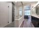 Modern bathroom with a walk-in shower and double vanity at 16914 W Merrell St, Goodyear, AZ 85395