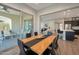 Bright dining room with a view of the patio and kitchen at 16914 W Merrell St, Goodyear, AZ 85395