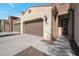 Inviting exterior of a two-story home with a modern design and attached garage at 16914 W Merrell St, Goodyear, AZ 85395