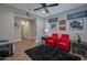 Relaxing sitting area with red armchairs and wall art at 16914 W Merrell St, Goodyear, AZ 85395