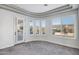 Bedroom with backyard view and plantation shutters at 17730 W Redwood Ln, Goodyear, AZ 85338