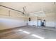 Garage with overhead storage racks and extra space at 17730 W Redwood Ln, Goodyear, AZ 85338