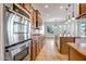 Kitchen with stainless steel appliances and wood cabinets at 17730 W Redwood Ln, Goodyear, AZ 85338