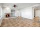 Spacious living room with fireplace and tile floors at 17730 W Redwood Ln, Goodyear, AZ 85338