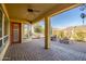 Covered patio with fire pit and outdoor seating area at 17730 W Redwood Ln, Goodyear, AZ 85338