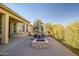 Outdoor patio with fire pit and seating area at 17730 W Redwood Ln, Goodyear, AZ 85338