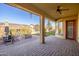 Covered patio with fire pit and outdoor seating area at 17730 W Redwood Ln, Goodyear, AZ 85338