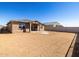 View of the rear of the home and the backyard at 17803 W Elm St, Goodyear, AZ 85395