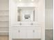 Bathroom featuring a large mirror and double sinks at 17803 W Elm St, Goodyear, AZ 85395