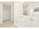 Bathroom featuring a large mirror and double sinks at 17803 W Elm St, Goodyear, AZ 85395