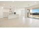 Open concept kitchen and dining area with sliding glass door to yard at 17803 W Elm St, Goodyear, AZ 85395