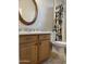 Bathroom with wood cabinets and tile flooring at 18546 E Oak Hill Ln, Queen Creek, AZ 85142