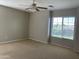 Bright bedroom with large window and neutral walls at 18546 E Oak Hill Ln, Queen Creek, AZ 85142