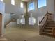 Bright entryway with high ceilings, mirrored wall, and staircase at 18546 E Oak Hill Ln, Queen Creek, AZ 85142