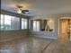 Living room with tile floor and view of staircase at 18546 E Oak Hill Ln, Queen Creek, AZ 85142