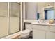 Bathroom with a walk-in shower, toilet, and updated vanity at 18852 N Aztec Dr, Sun City, AZ 85373