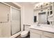 Clean bathroom featuring a glass-enclosed shower, white vanity, and modern fixtures at 18852 N Aztec Dr, Sun City, AZ 85373