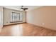 Simple bedroom with hardwood floors, bay window and neutral walls at 18852 N Aztec Dr, Sun City, AZ 85373