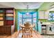 Bright dining area with bay window and wood table at 18852 N Aztec Dr, Sun City, AZ 85373