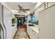 Galley style kitchen with white cabinets and stainless steel appliances at 18852 N Aztec Dr, Sun City, AZ 85373