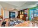 Bright living room with hardwood floors and built-in shelving at 18852 N Aztec Dr, Sun City, AZ 85373