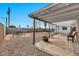 Backyard with covered patio, seating area, and a large grassy area at 2087 E 10Th St, Tempe, AZ 85281