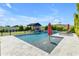 Inviting backyard pool with pergola, lounge chairs, and water feature at 21961 E Via De Arboles St, Queen Creek, AZ 85142