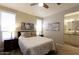 Bright bedroom with ceiling fan and ensuite bathroom at 2206 S Ellsworth Rd # 72B, Mesa, AZ 85209