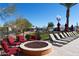 Relaxing fire pit with comfortable seating and red chairs at 2206 S Ellsworth Rd # 72B, Mesa, AZ 85209