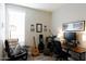 Home office with a desk, chair, and musical instrument at 2206 S Ellsworth Rd # 72B, Mesa, AZ 85209