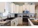 White shaker cabinets, granite counters, and stainless steel appliances at 2206 S Ellsworth Rd # 72B, Mesa, AZ 85209