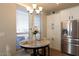 Bright kitchen nook with round table and chairs at 2206 S Ellsworth Rd # 72B, Mesa, AZ 85209