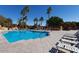 Relax by the community pool with lounge chairs at 2206 S Ellsworth Rd # 72B, Mesa, AZ 85209