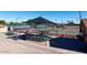 Well-maintained tennis courts with shade structures at 2206 S Ellsworth Rd # 72B, Mesa, AZ 85209