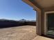 Covered patio overlooking a large backyard and mountains at 22665 E Stacey Rd, Queen Creek, AZ 85142