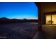 Empty backyard with a view of the mountains at sunset at 22665 E Stacey Rd, Queen Creek, AZ 85142