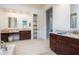 Luxurious bathroom with dual vanities, granite countertops, and ample storage at 22665 E Stacey Rd, Queen Creek, AZ 85142