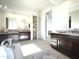 Bright bathroom with double vanities, granite countertops, and tile flooring, offering a clean and modern look at 22665 E Stacey Rd, Queen Creek, AZ 85142