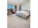 Bright bedroom features large window, comfortable seating, and stylish decor at 22665 E Stacey Rd, Queen Creek, AZ 85142
