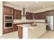 Island kitchen with granite countertops and stainless steel appliances at 22665 E Stacey Rd, Queen Creek, AZ 85142