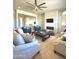 Cozy living room showcasing comfortable seating, a modern fireplace, and neutral decor at 22665 E Stacey Rd, Queen Creek, AZ 85142