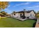 White brick home with putting green at 2366 E Becker Ln, Phoenix, AZ 85028