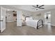 Bedroom with black metal bed frame and white bedding, adjacent sitting area at 2366 E Becker Ln, Phoenix, AZ 85028