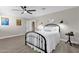 Bedroom with black metal bed frame and white bedding at 2366 E Becker Ln, Phoenix, AZ 85028