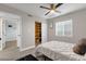 Bright bedroom with built-in shelves and window blinds at 2366 E Becker Ln, Phoenix, AZ 85028