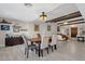 Elegant dining room with hardwood floors, a formal dining table and view into the living room at 2366 E Becker Ln, Phoenix, AZ 85028