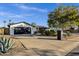 Ranch style home with a landscaped front yard, driveway, and two-car garage at 2366 E Becker Ln, Phoenix, AZ 85028