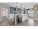 Modern kitchen with white cabinets, blue tile backsplash, and an island at 2366 E Becker Ln, Phoenix, AZ 85028